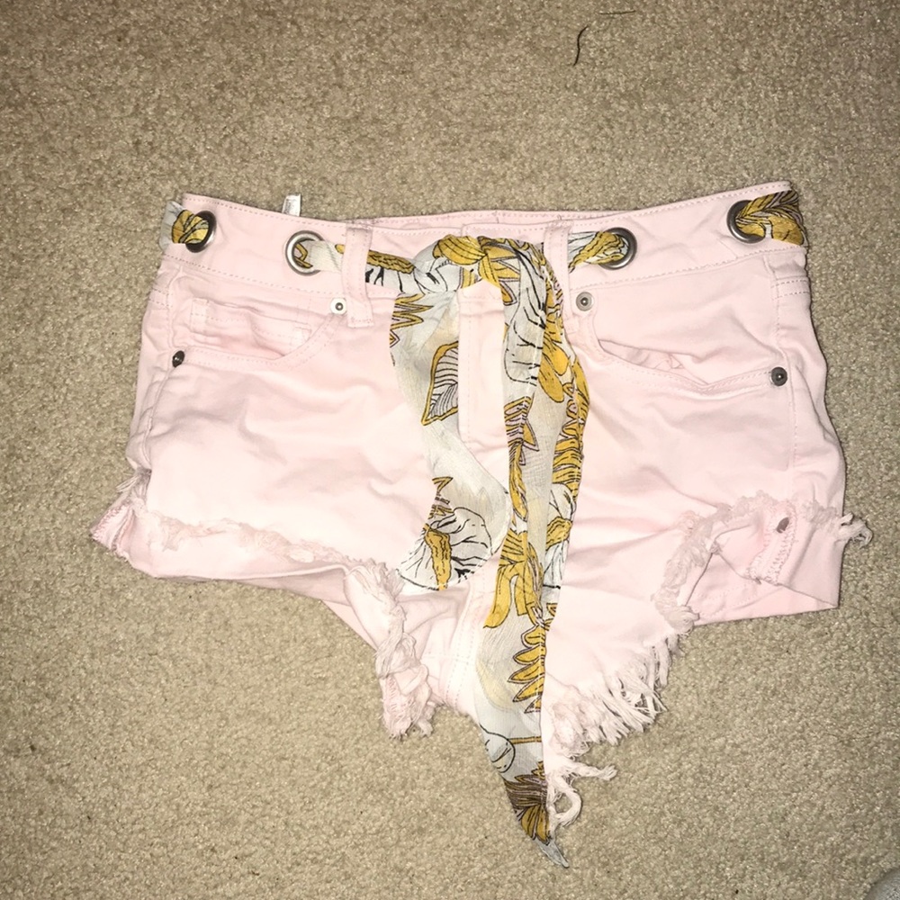 Pink denim shorts with belt